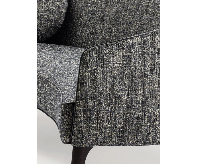 Jackie Sofa by Frigerio featuring a curved silhouette, sculpted armrests, and refined Italian craftsmanship | Casa Design Group