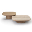 Enook coffee table crafted from solid wood, featuring a square tabletop with rounded corners and a sculptural cylindrical base in a contemporary design.