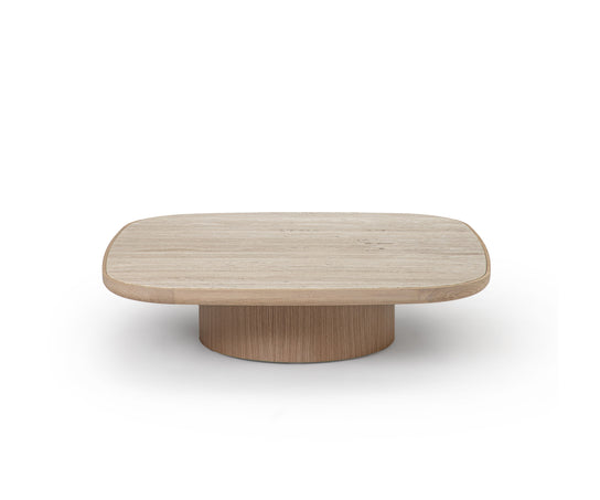Enook coffee table crafted from solid wood, featuring a square tabletop with rounded corners and a sculptural cylindrical base in a contemporary design.