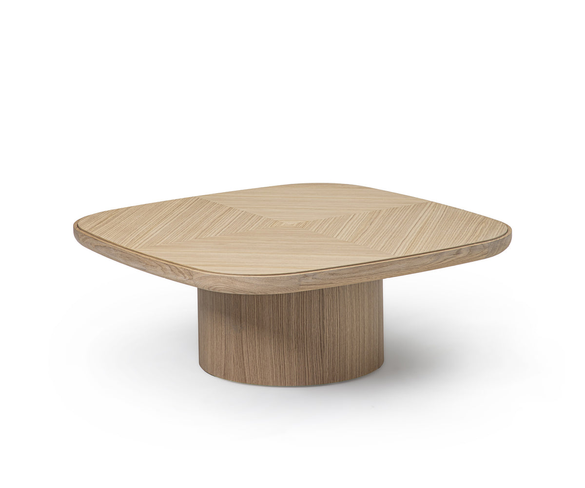 Enook coffee table crafted from solid wood, featuring a square tabletop with rounded corners and a sculptural cylindrical base in a contemporary design.