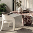 Contemporary Fosca dining chair by Frigerio with sculptural upholstered design