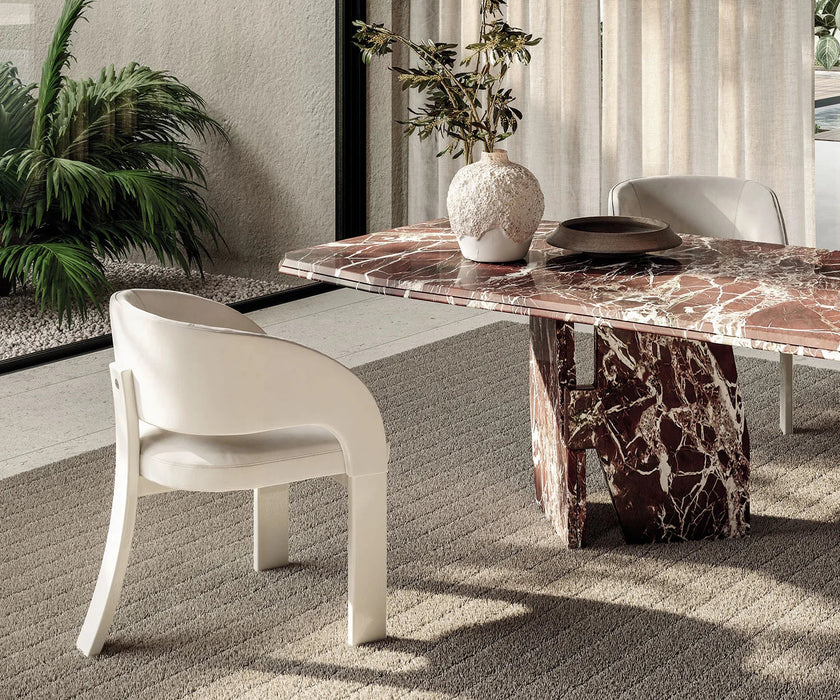 Contemporary Fosca dining chair by Frigerio with sculptural upholstered design