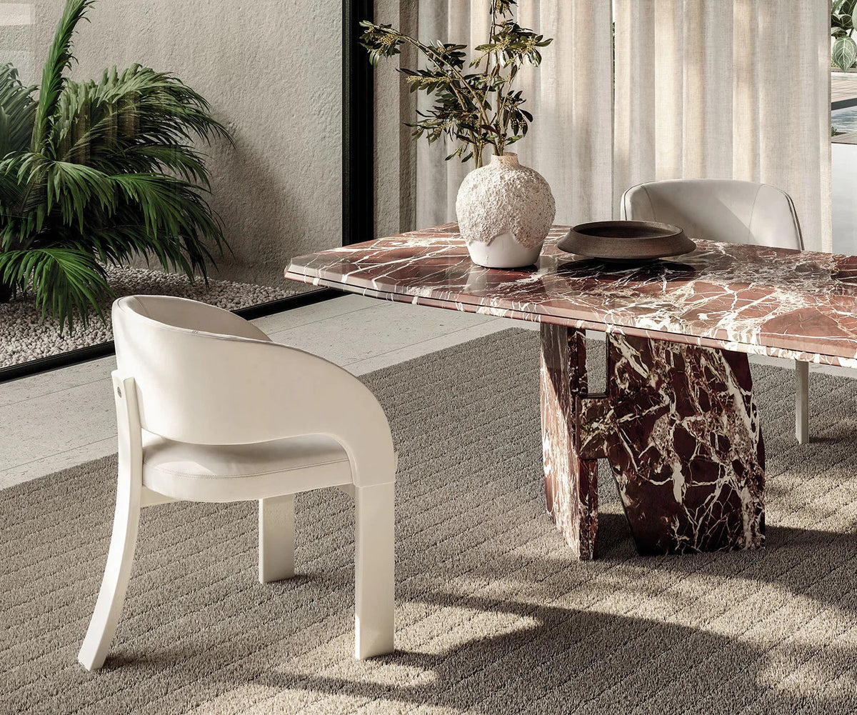 Contemporary Fosca dining chair by Frigerio with sculptural upholstered design