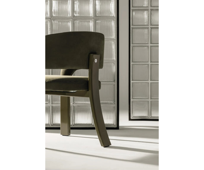 Contemporary Fosca dining chair by Frigerio with sculptural upholstered design