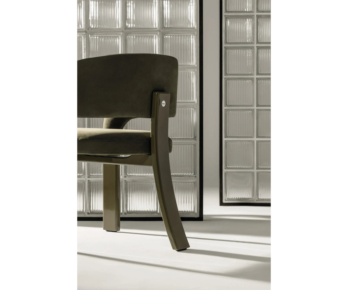 Contemporary Fosca dining chair by Frigerio with sculptural upholstered design