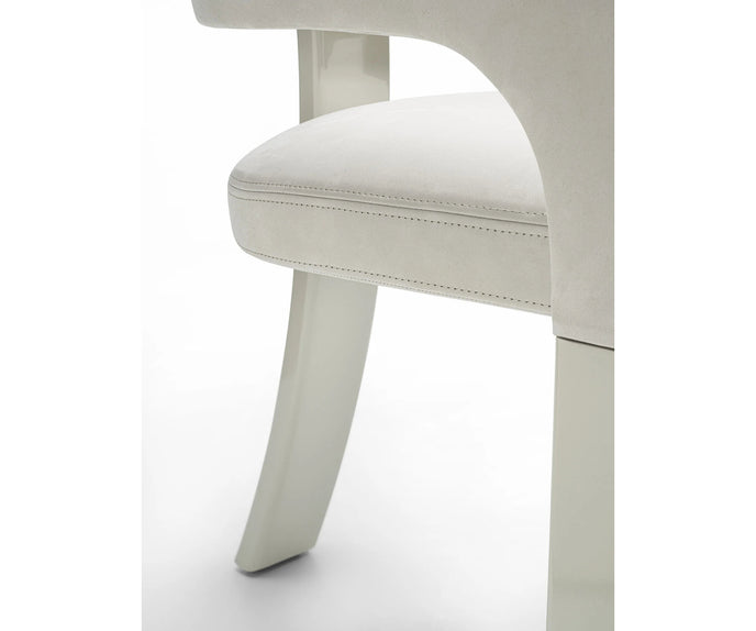 Contemporary Fosca dining chair by Frigerio with sculptural upholstered design