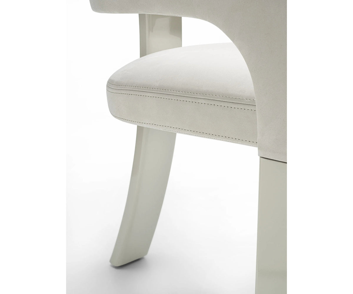 Contemporary Fosca dining chair by Frigerio with sculptural upholstered design