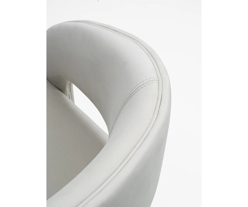 Contemporary Fosca dining chair by Frigerio with sculptural upholstered design