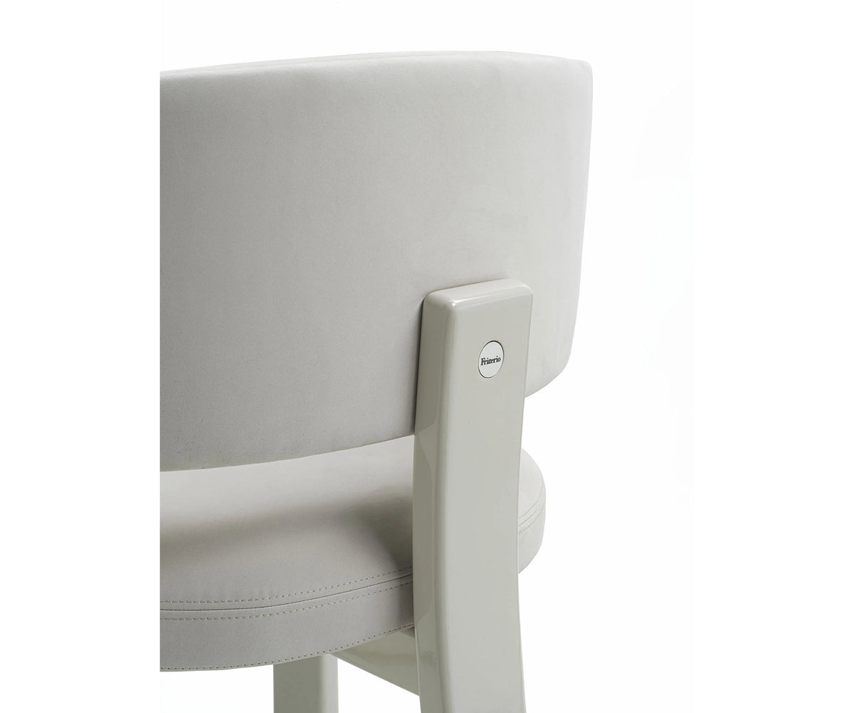 Contemporary Fosca dining chair by Frigerio with sculptural upholstered design