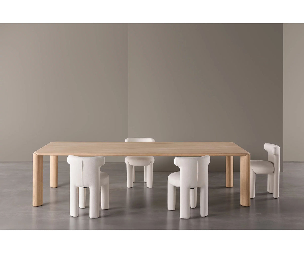 Frank Dining Table by Meridiani with tapered legs and refined contemporary design Casa Design Group