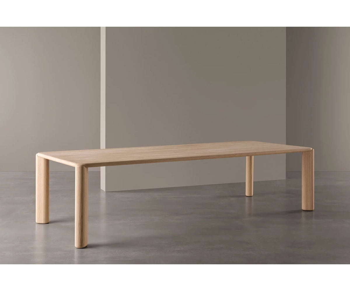 Frank Dining Table by Meridiani with tapered legs and refined contemporary design Casa Design Group