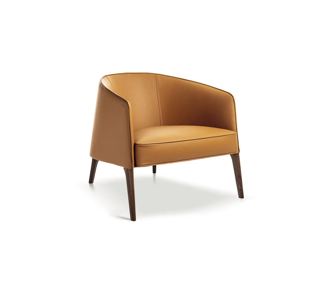 Frigerio Jackie upholstered armchair with solid ashwood legs and tailored fabric or leather upholstery, available at Casa Design Group.