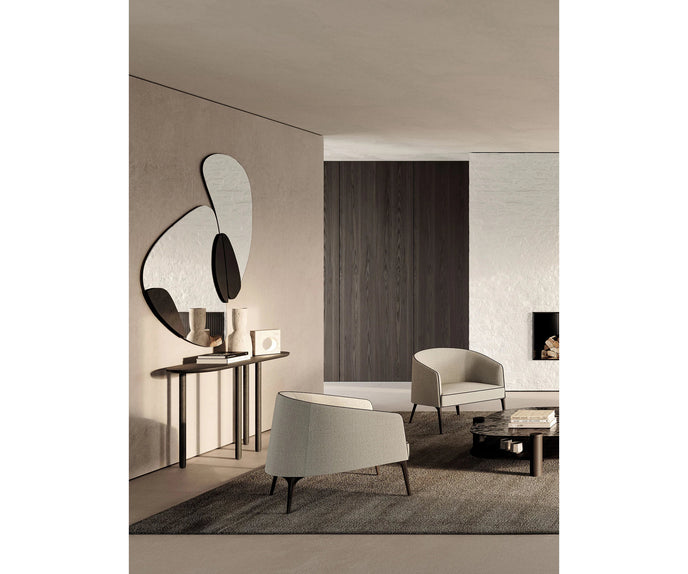 Frigerio Jackie upholstered armchair with solid ashwood legs and tailored fabric or leather upholstery, available at Casa Design Group.