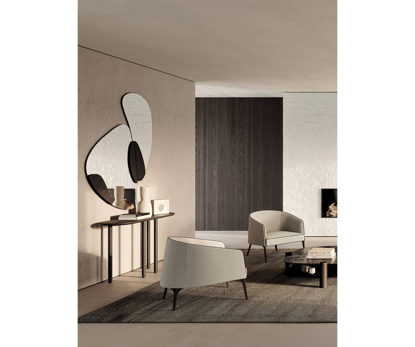 Frigerio Jackie upholstered armchair with solid ashwood legs and tailored fabric or leather upholstery, available at Casa Design Group.