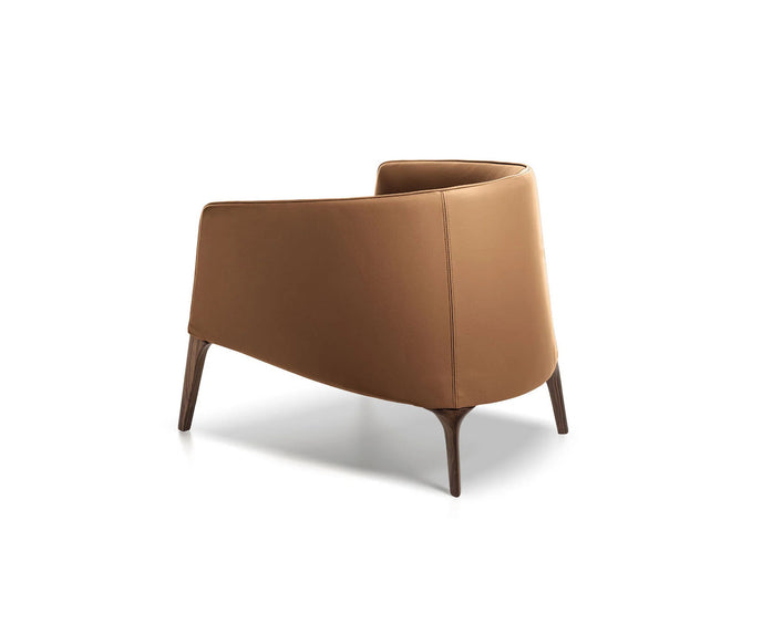 Frigerio Jackie upholstered armchair with solid ashwood legs and tailored fabric or leather upholstery, available at Casa Design Group.
