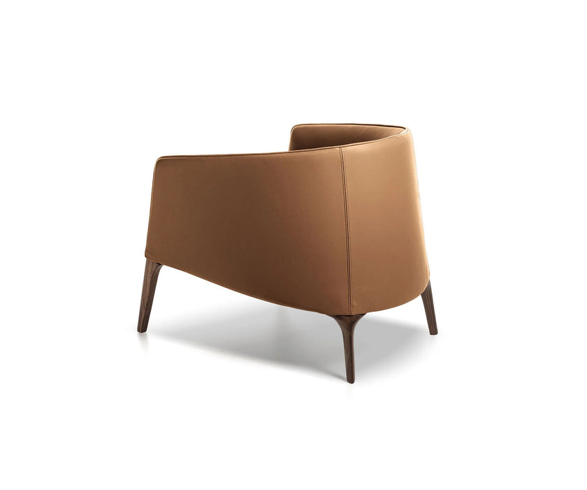 Frigerio Jackie upholstered armchair with solid ashwood legs and tailored fabric or leather upholstery, available at Casa Design Group.