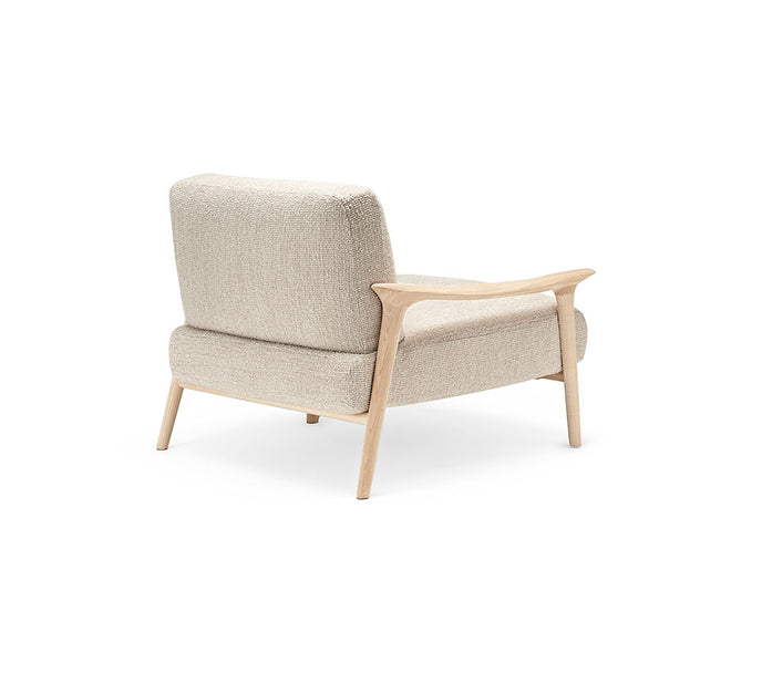 Giselle Lounge Chair with sculpted ashwood frame, integrated wooden armrests and generously upholstered cushions by Cattelan Italia | Casa Design Group