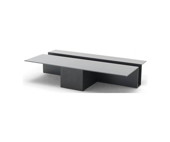 Grek Coffee Table by Living Divani featuring a sculptural design with an integrated magazine holder.