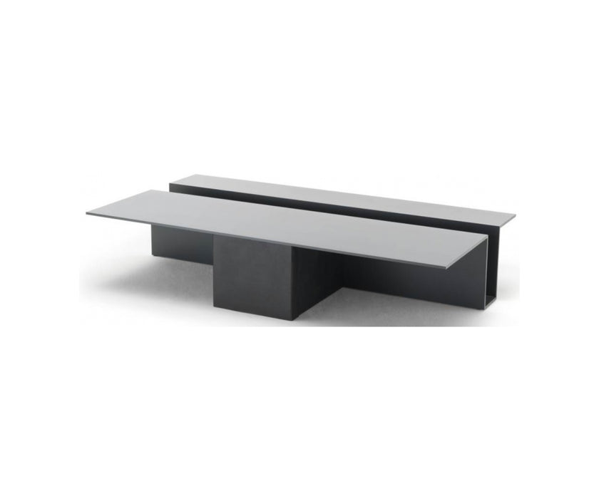 Grek Coffee Table by Living Divani featuring a sculptural design with an integrated magazine holder.