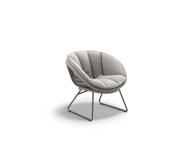 Kida Lounge Chair by Dedon with sculptural frame and striped Fiber wrap – Casa Design Group
