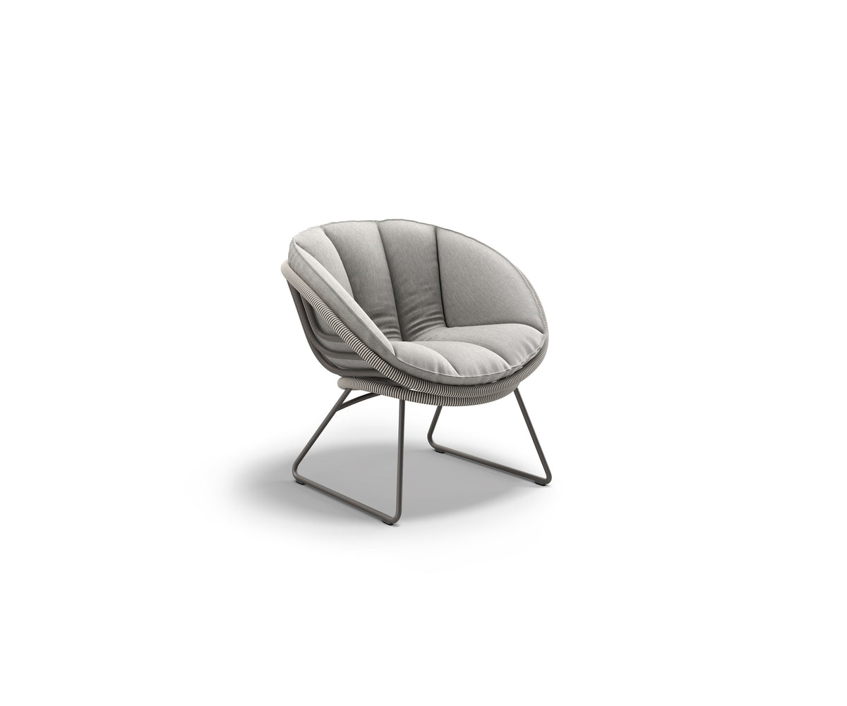 Kida Lounge Chair by Dedon with sculptural frame and striped Fiber wrap – Casa Design Group