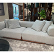Klem floor sample sofa by Porada with Canaletta walnut frame and upholstered seating | Casa Design Group