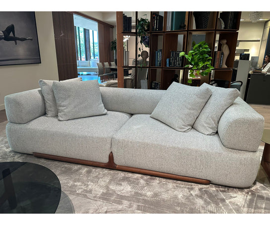 Klem floor sample sofa by Porada with Canaletta walnut frame and upholstered seating | Casa Design Group
