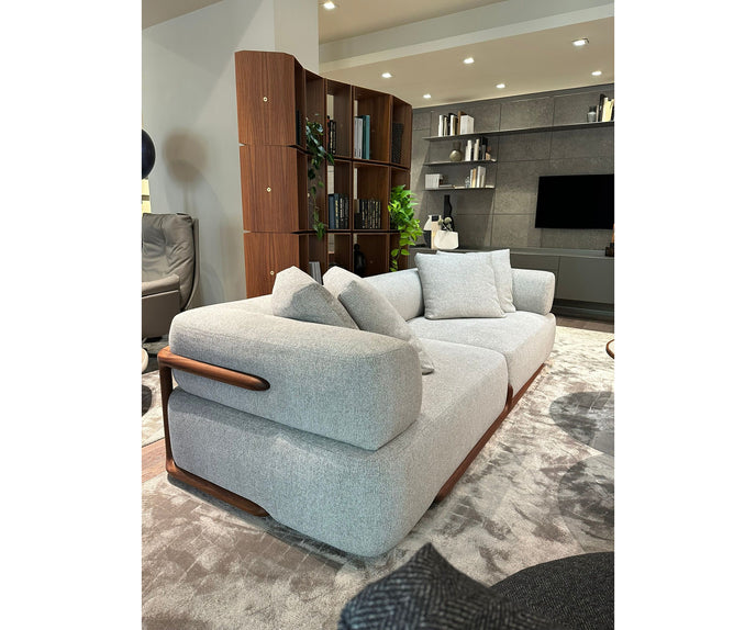 Klem floor sample sofa by Porada with Canaletta walnut frame and upholstered seating | Casa Design Group