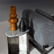 Kor Sculptural C Table with Natural Stone Top and Polished Steel Base by Baxter | Casa Design Group