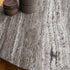 Kor Sculptural Coffee Table with Natural Stone Top and Polished Antiqued Steel Base by Baxter | Casa Design Group