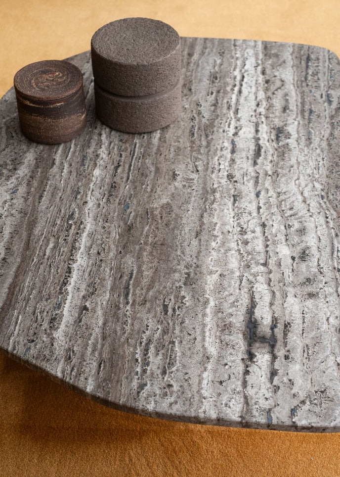 Kor Sculptural Coffee Table with Natural Stone Top and Polished Antiqued Steel Base by Baxter | Casa Design Group