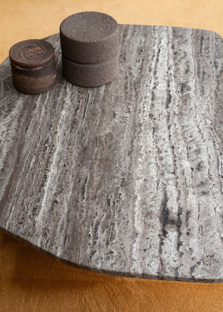Kor Sculptural Coffee Table with Natural Stone Top and Polished Antiqued Steel Base by Baxter | Casa Design Group