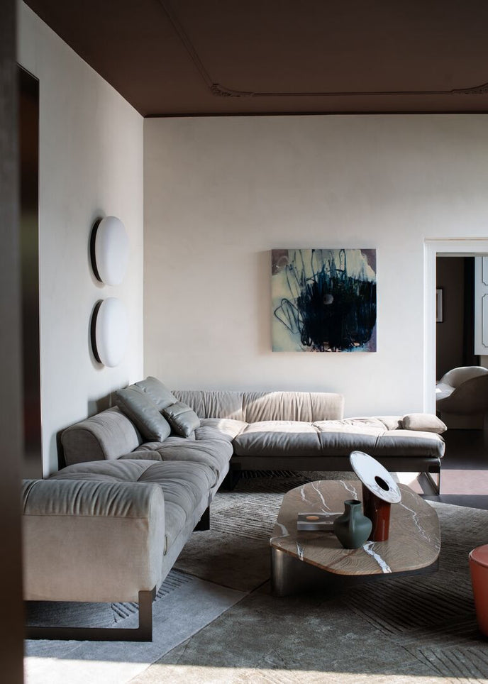 Kor Sculptural Coffee Table with Natural Stone Top and Polished Antiqued Steel Base by Baxter | Casa Design Group