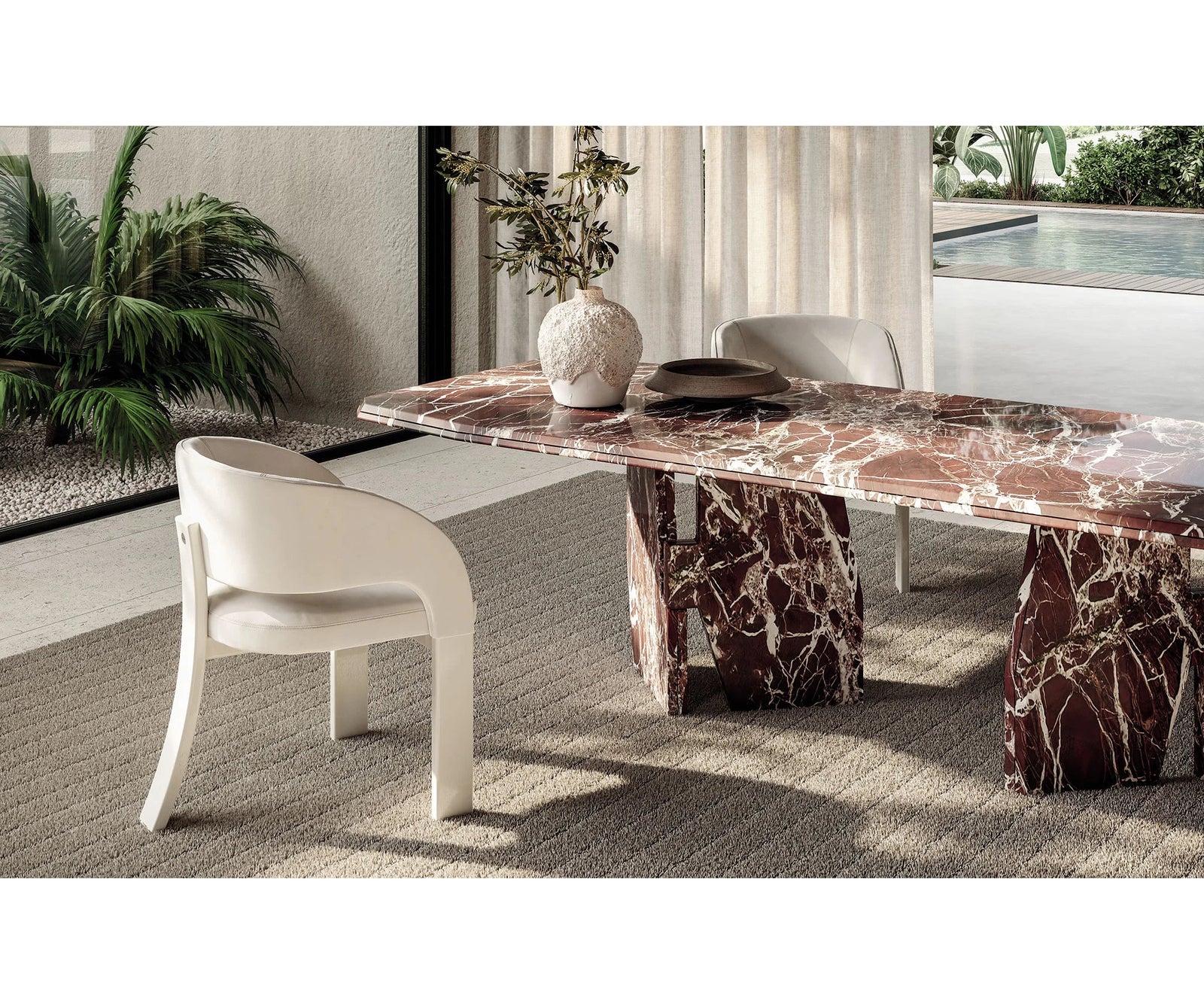 Frigerio Kumo Dining Table with sculptural marble base and refined contemporary design for luxury dining interiors Casa Design Group