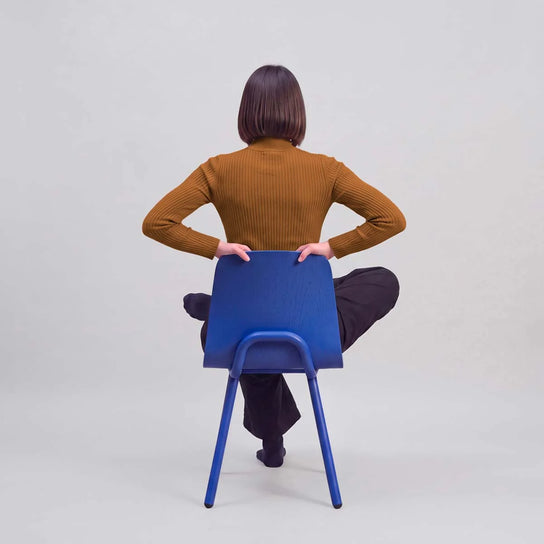 Kuskoa M Dining Chair with curved oak veneer shell and slender powder-coated steel frame by Alki | Casa Design Group