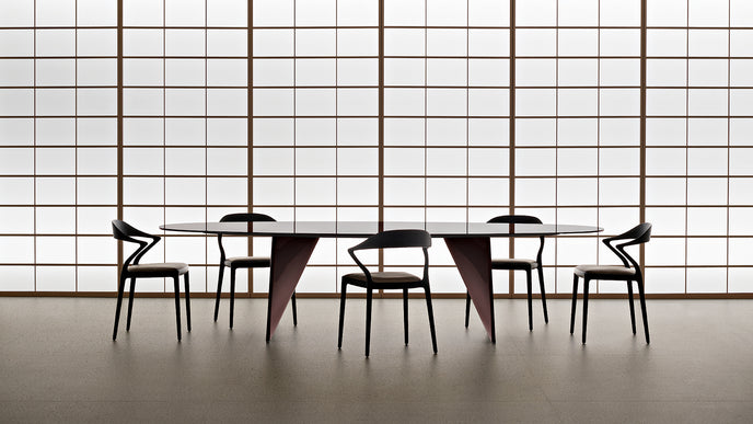 Lambda Dining Table with sculptural folded base and elegant contemporary finishes by Rimadesio | Casa Design Group