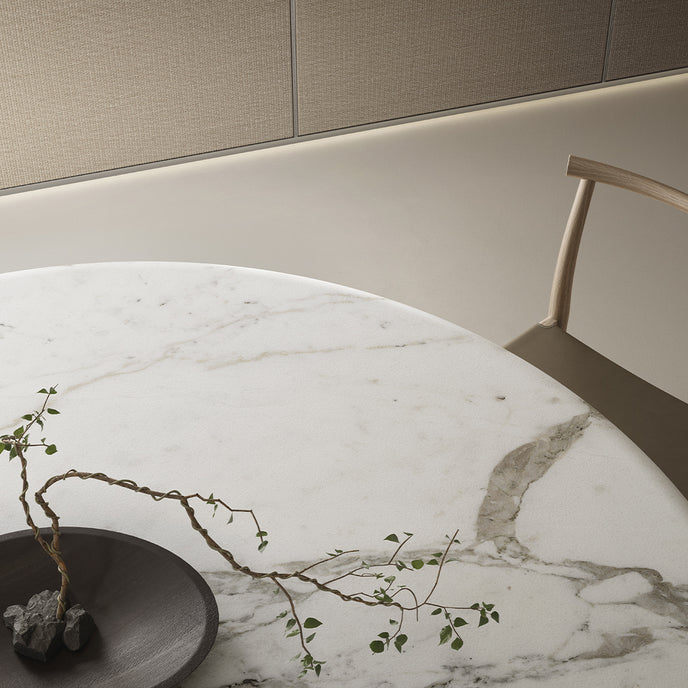 Lambda Dining Table with sculptural folded base and elegant contemporary finishes by Rimadesio | Casa Design Group