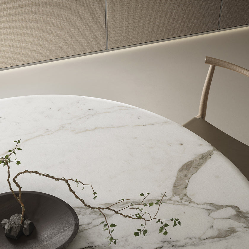Lambda Dining Table with sculptural folded base and elegant contemporary finishes by Rimadesio | Casa Design Group