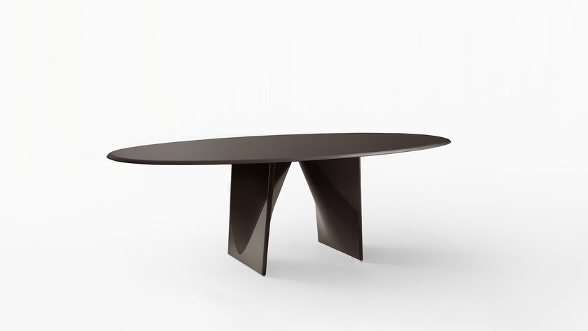 Lambda Dining Table with sculptural folded base and elegant contemporary finishes by Rimadesio | Casa Design Group
