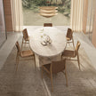 Lambda Dining Table with sculptural folded base and elegant contemporary finishes by Rimadesio | Casa Design Group