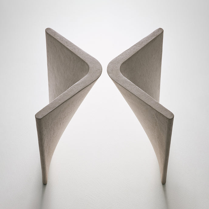 Lambda Dining Table with sculptural folded base and elegant contemporary finishes by Rimadesio | Casa Design Group