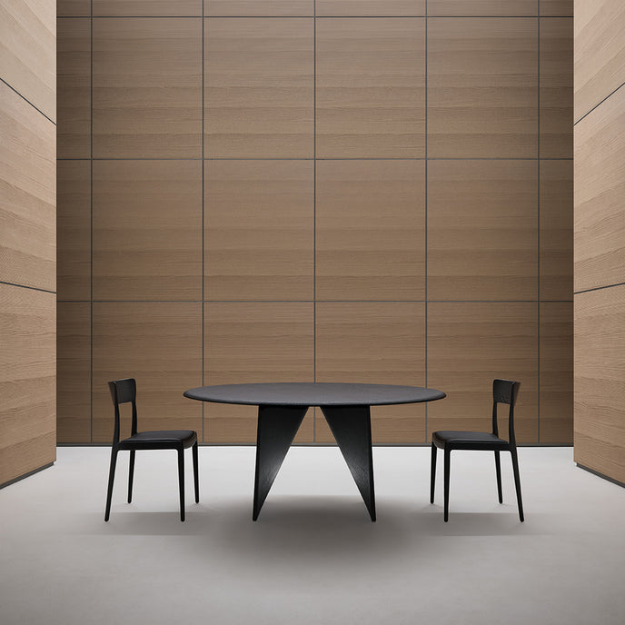 Lambda Dining Table with sculptural folded base and elegant contemporary finishes by Rimadesio | Casa Design Group
