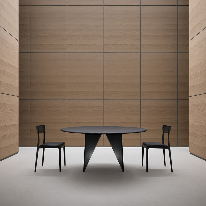 Lambda Dining Table with sculptural folded base and elegant contemporary finishes by Rimadesio | Casa Design Group