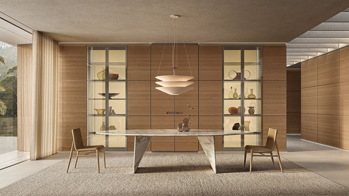 Lambda Dining Table with sculptural folded base and elegant contemporary finishes by Rimadesio | Casa Design Group