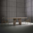 Lambda Dining Table with sculptural folded base and elegant contemporary finishes by Rimadesio | Casa Design Group