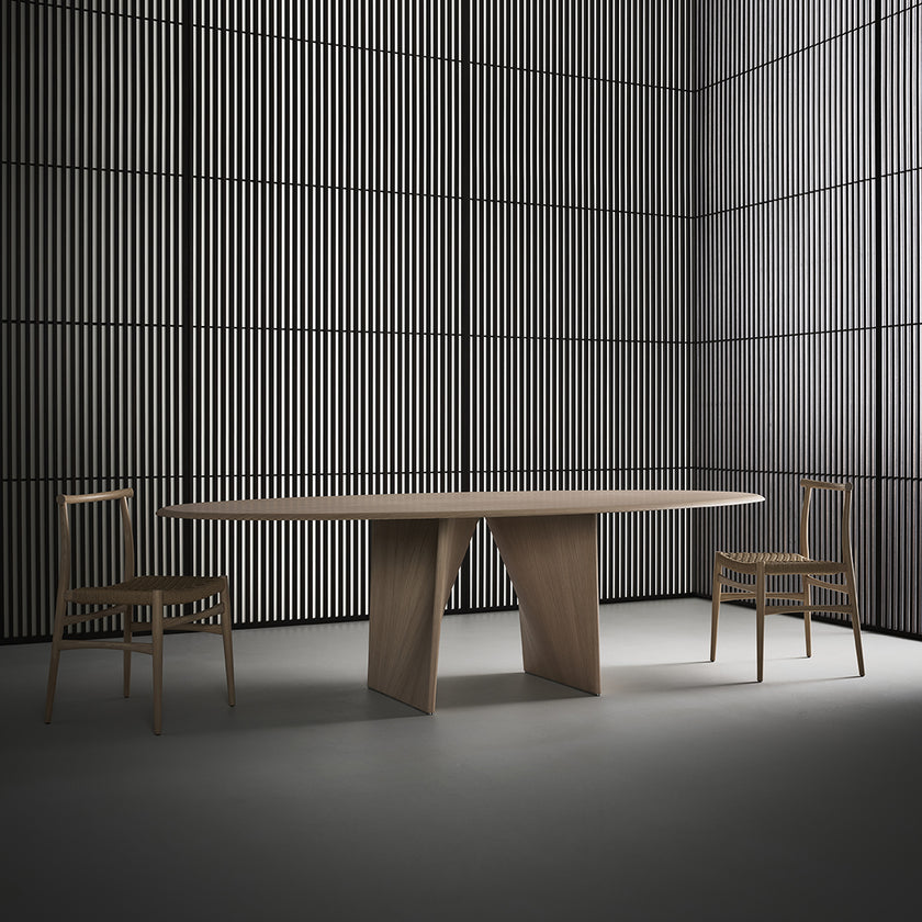 Lambda Dining Table with sculptural folded base and elegant contemporary finishes by Rimadesio | Casa Design Group