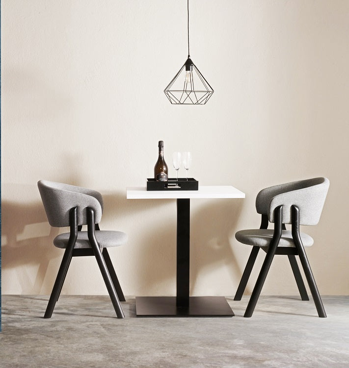 Lambda S Dining Chair with sculpted wooden double legs, curved upholstered backrest and padded seat by Accento | Casa Design Group