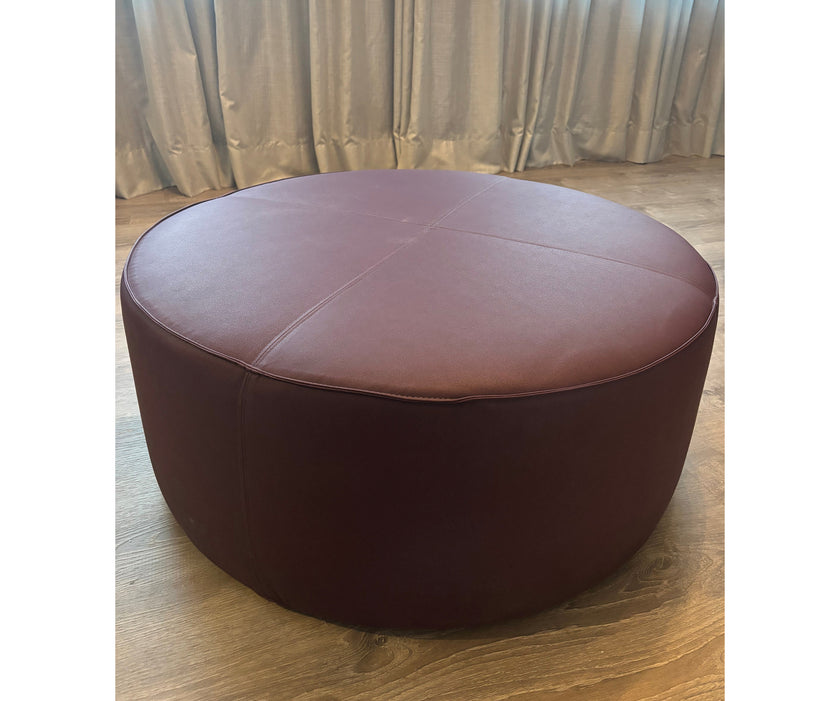 Contemporary burgundy leather round ottoman floor sample – Casa Design Group