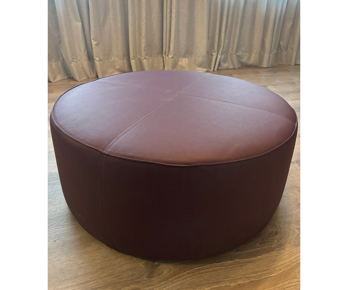 Contemporary burgundy leather round ottoman floor sample – Casa Design Group