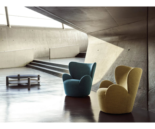 Libelle Armchair by Frigerio featuring a sculptural silhouette inspired by dragonfly wings, upholstered seating, and contemporary Italian design.